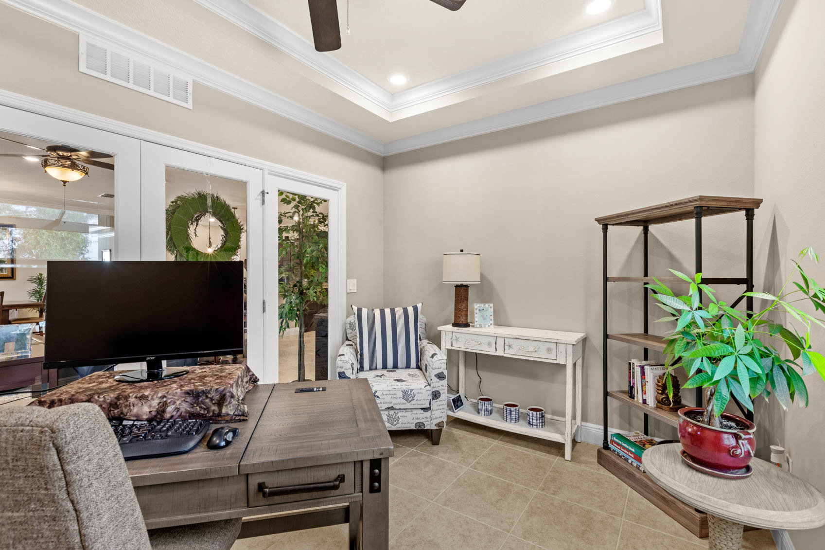 small office space with desk and bookshelf